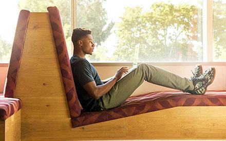 A student studying on a laptop at University of Bridgeport